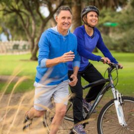 Senior couple running and biking